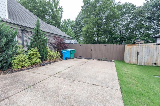 view of patio with a gate