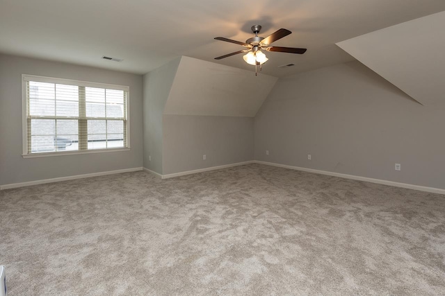 bonus room with carpet floors, a ceiling fan, baseboards, and vaulted ceiling