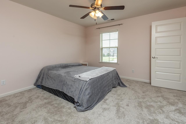bedroom with carpet flooring, baseboards, and ceiling fan