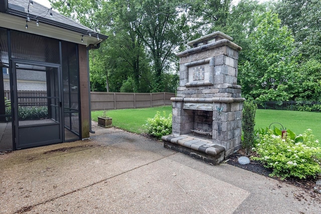 view of patio / terrace with an outdoor stone fireplace