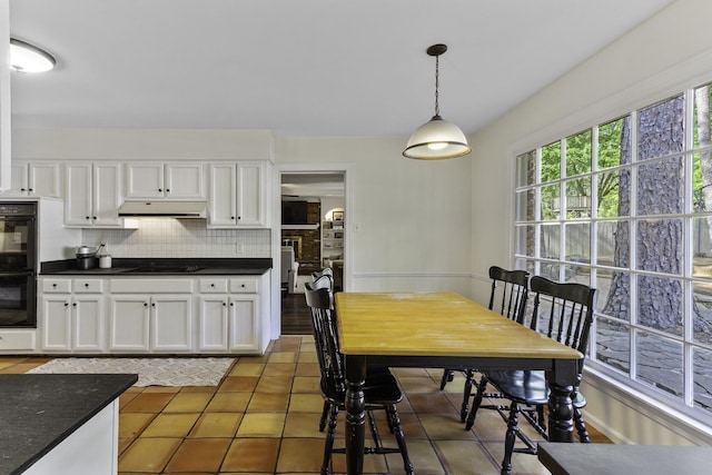 dining space with light tile patterned floors