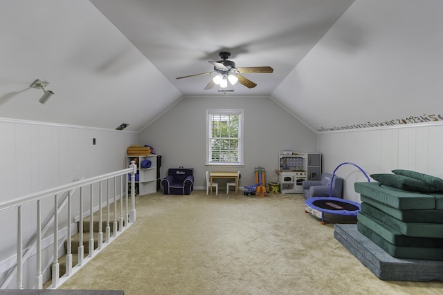 playroom with ceiling fan, carpet flooring, and vaulted ceiling