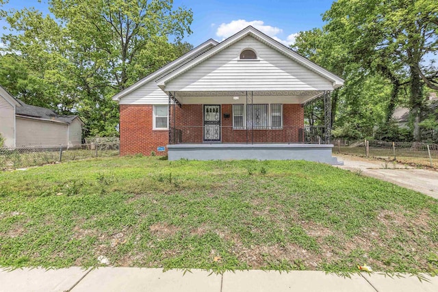 686 Looney Ave, Memphis, TN 38107 - view of front facade featuring a porch and brick siding