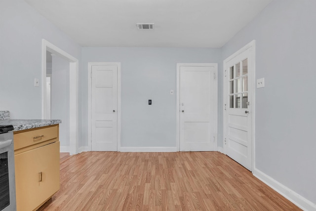 686 Looney Ave, Memphis, TN 38107 - kitchen featuring light wood-style floors, light countertops, and baseboards