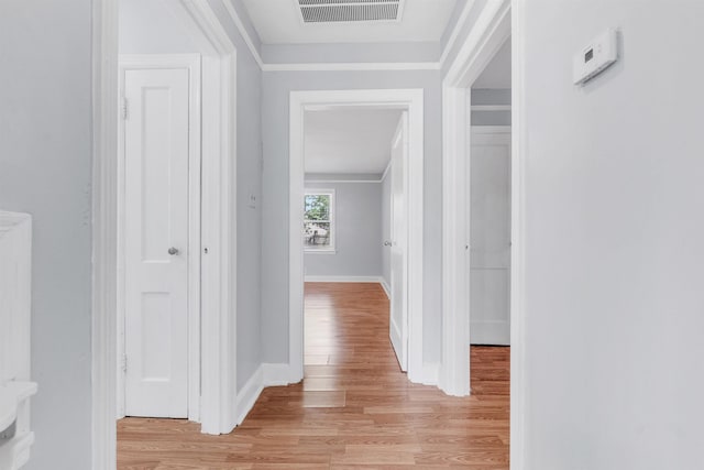 686 Looney Ave, Memphis, TN 38107 - corridor with light wood-type flooring, baseboards, and ornamental molding