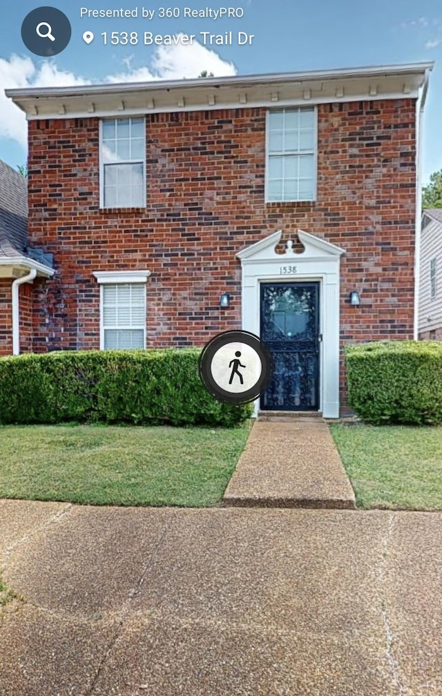 view of front of property featuring brick siding