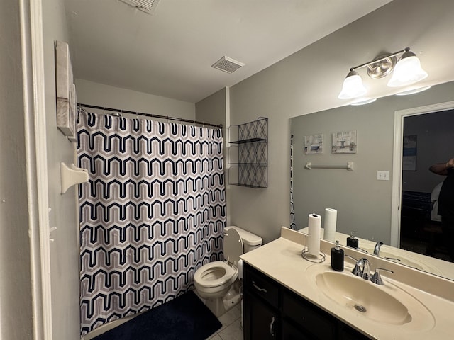 bathroom featuring toilet, vanity, curtained shower, and tile patterned floors