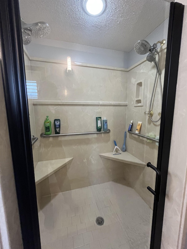 8130 Julie Cv, Millington, TN 38053 - bathroom with a stall shower and a textured ceiling