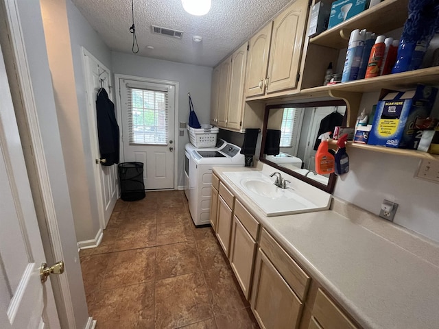 8130 Julie Cv, Millington, TN 38053 - washroom featuring a textured ceiling, separate washer and dryer, cabinet space, and dark tile patterned floors