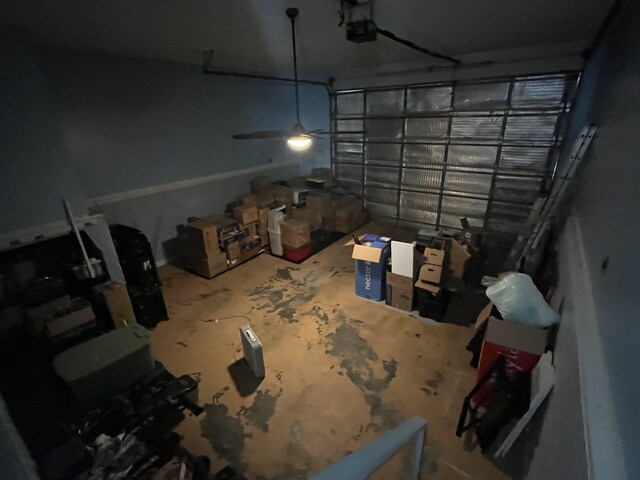 8130 Julie Cv, Millington, TN 38053 - garage with a garage door opener and a ceiling fan