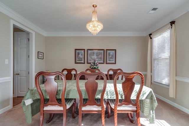 carpeted dining area featuring a chandelier, crown molding, and baseboards