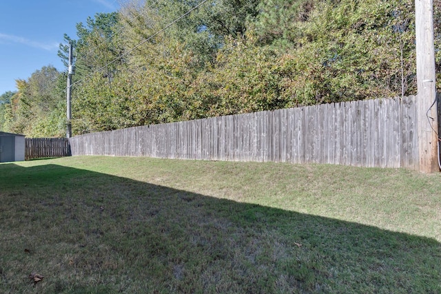 view of yard with an outdoor structure and a storage unit