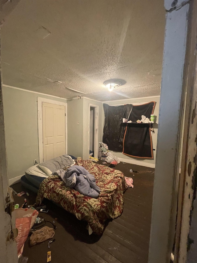 3766 Orchi Rd, Memphis, TN 38108 - bedroom with wood finished floors and a textured ceiling