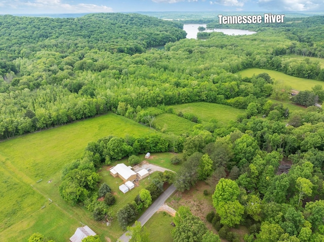 aerial view of a heavily wooded area and a large body of water