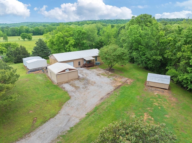 view from above of property featuring a heavily wooded area