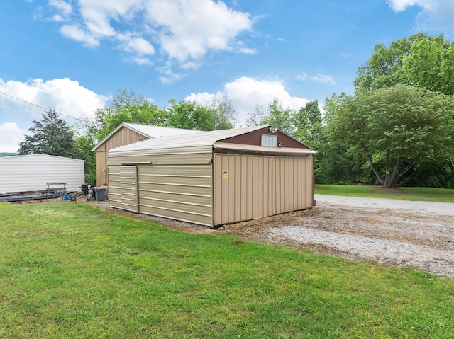view of pole building with a yard