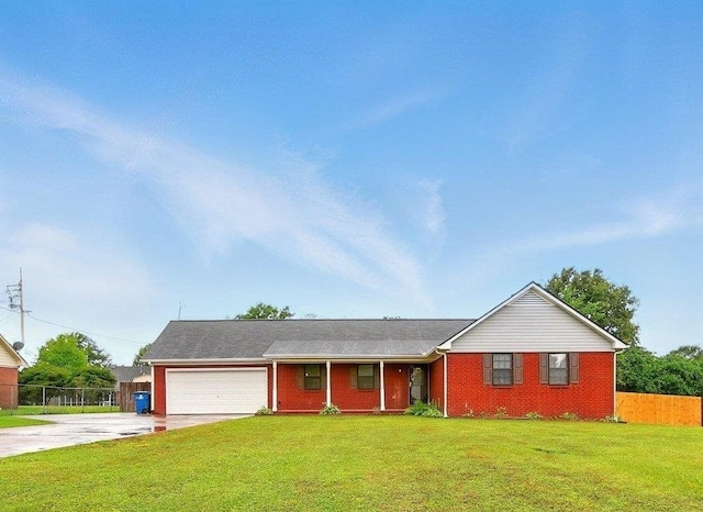 63 Kingston Ave, Atoka, TN 38004 - ranch-style house with an attached garage, driveway, and brick siding
