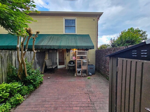 1212 Bristol Dr Unit 1212, Memphis, TN 38119 - rear view of property with a patio, fence, and central air condition unit