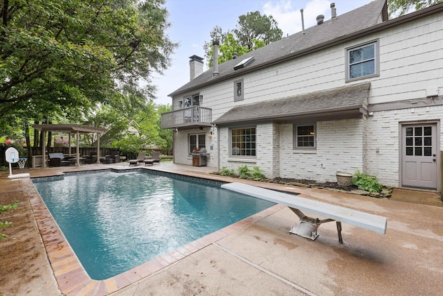 view of pool featuring a diving board, a patio area, a pergola, and fence