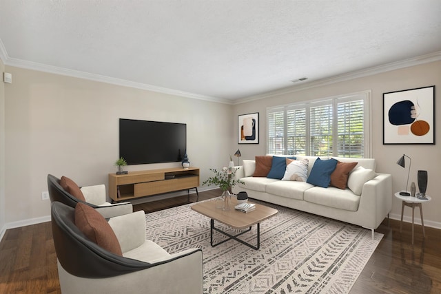 living area with baseboards, ornamental molding, wood finished floors, and a textured ceiling