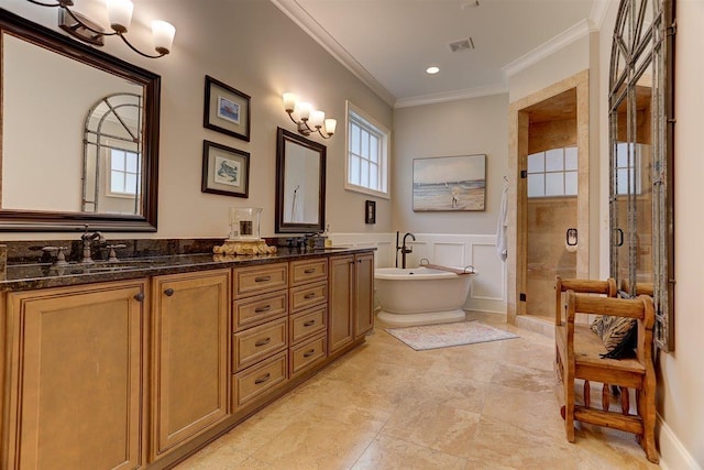 1948 Clarington Dr, Germantown, TN 38138 - full bath with double vanity, a shower stall, ornamental molding, a freestanding tub, and recessed lighting