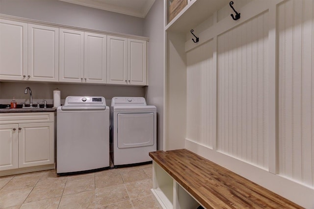 1948 Clarington Dr, Germantown, TN 38138 - washroom featuring cabinet space, washer and clothes dryer, and ornamental molding