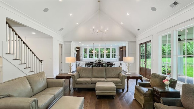 335 Blain St, Rossville, TN 38066 - living room featuring a chandelier, dark wood-style flooring, high vaulted ceiling, crown molding, and stairs