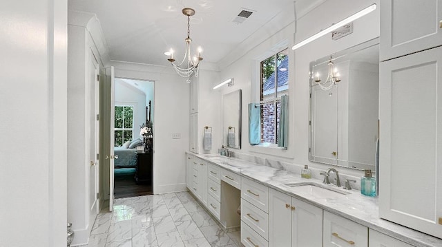 335 Blain St, Rossville, TN 38066 - ensuite bathroom with a chandelier, plenty of natural light, double vanity, and crown molding