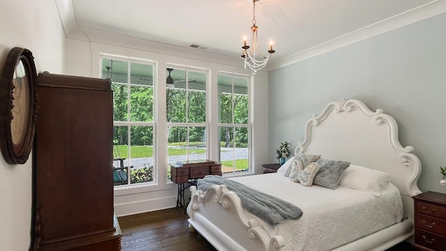 335 Blain St, Rossville, TN 38066 - bedroom featuring dark wood finished floors, ornamental molding, baseboards, and a chandelier