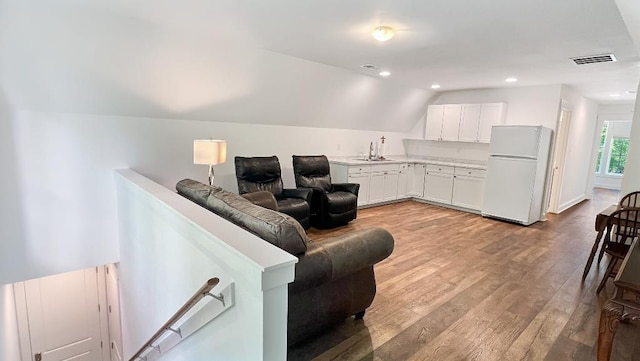 335 Blain St, Rossville, TN 38066 - living room with lofted ceiling, light wood-style flooring, and recessed lighting