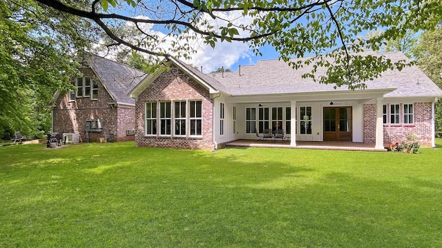 335 Blain St, Rossville, TN 38066 - rear view of property featuring brick siding, a yard, ceiling fan, a shingled roof, and a patio