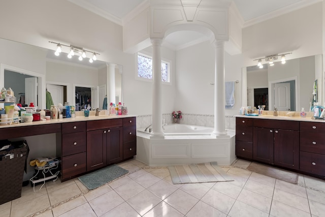bathroom featuring decorative columns, tile patterned floors, ornamental molding, and vanity