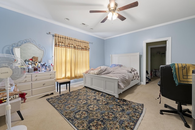 bedroom featuring light carpet, ornamental molding, and a ceiling fan
