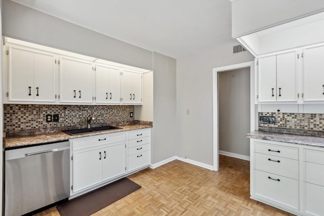 5305 Brantford Ave, Memphis, TN 38120 - kitchen with dishwasher, a sink, backsplash, and white cabinetry