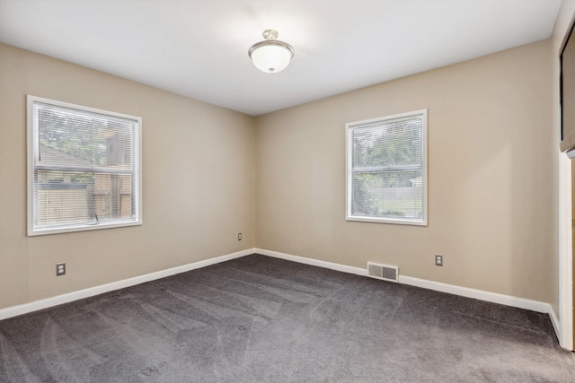 5305 Brantford Ave, Memphis, TN 38120 - spare room featuring dark carpet and baseboards