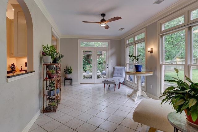 1917 Steeplebrook Cv, Cordova, TN 38016 - sitting room featuring a ceiling fan, crown molding, baseboards, arched walkways, and light tile patterned flooring