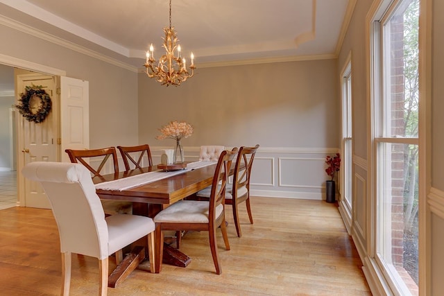 1917 Steeplebrook Cv, Cordova, TN 38016 - dining room featuring a tray ceiling, plenty of natural light, a wainscoted wall, and crown molding