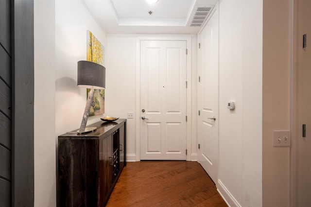 717 S Riverside Dr Unit 1203, Memphis, TN 38103 - doorway with dark wood-type flooring, a tray ceiling, and baseboards