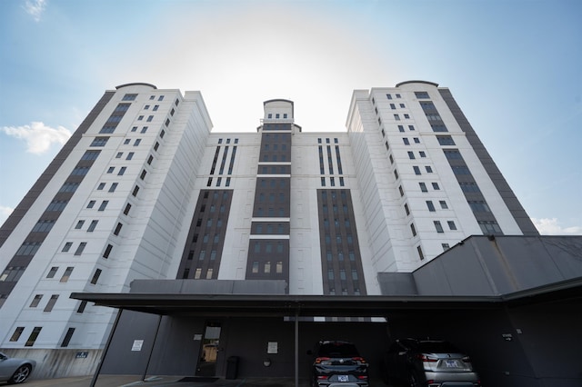 717 S Riverside Dr Unit 1203, Memphis, TN 38103 - view of building exterior featuring covered parking