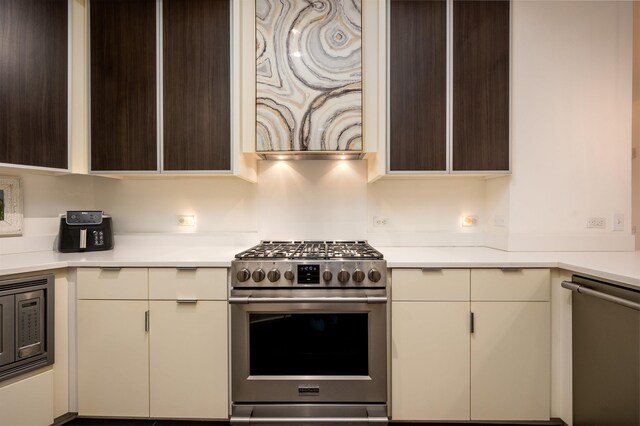 717 S Riverside Dr Unit 1203, Memphis, TN 38103 - kitchen featuring stainless steel appliances, light countertops, and dark brown cabinets