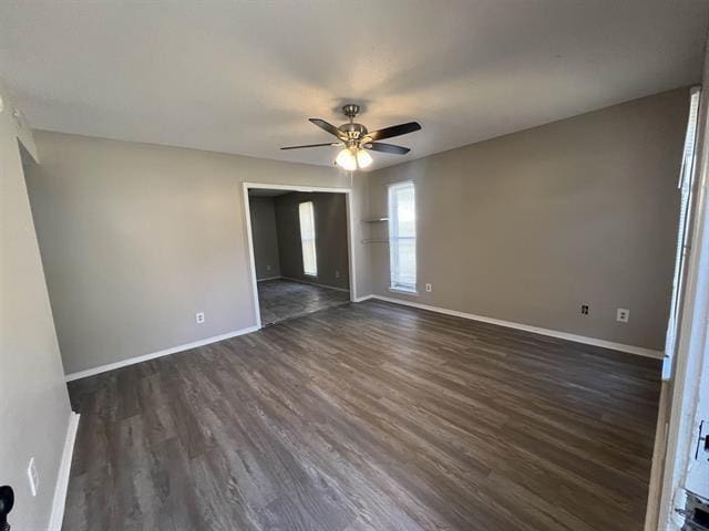 2151 Ptarmigan Trl, Memphis, TN 38134 - unfurnished bedroom featuring dark wood-style floors, baseboards, and ceiling fan