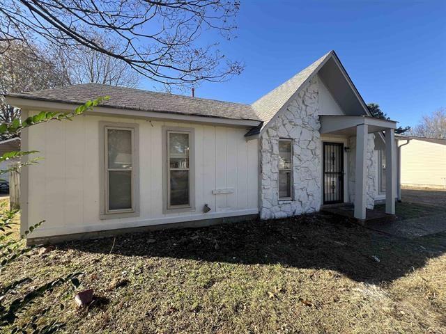 2151 Ptarmigan Trl, Memphis, TN 38134 - rear view of property with a shingled roof and stone siding