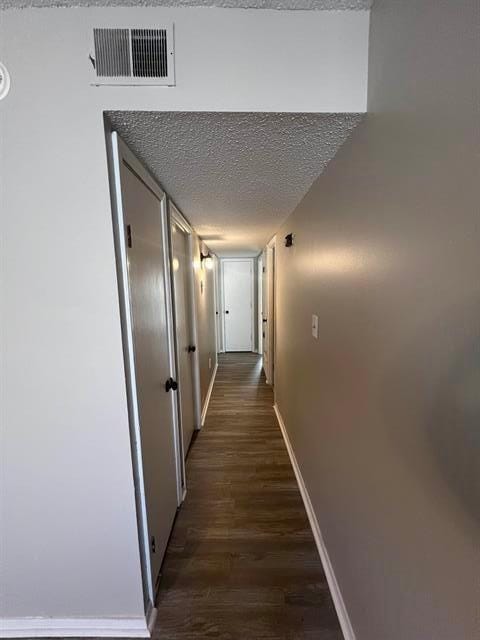 2151 Ptarmigan Trl, Memphis, TN 38134 - corridor featuring baseboards, a textured ceiling, and dark wood-style flooring