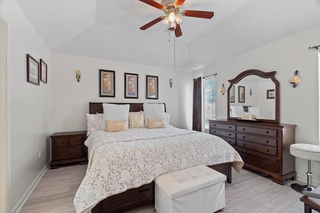 2518 Bassfield Dr, Memphis, TN 38133 - bedroom featuring light wood-style floors, baseboards, vaulted ceiling, and ceiling fan