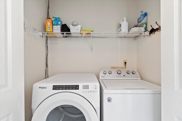 2518 Bassfield Dr, Memphis, TN 38133 - clothes washing area with independent washer and dryer