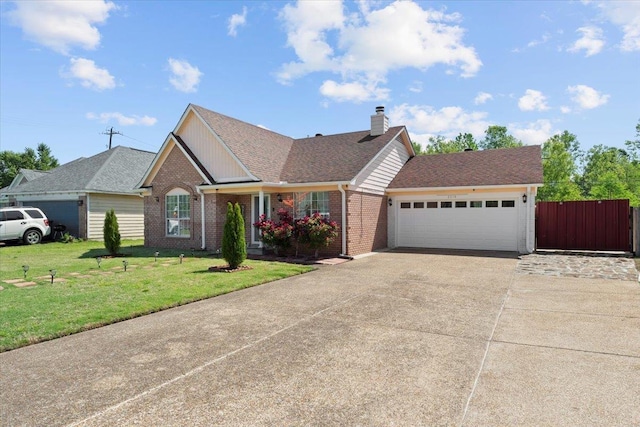 2518 Bassfield Dr, Memphis, TN 38133 - view of front of property featuring driveway, brick siding, an attached garage, a chimney, and roof with shingles