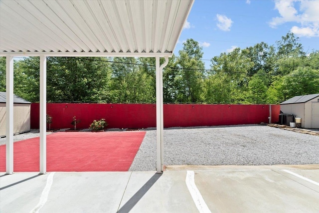 2518 Bassfield Dr, Memphis, TN 38133 - view of patio / terrace with a shed, an outbuilding, and fence
