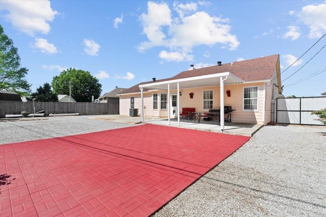 2518 Bassfield Dr, Memphis, TN 38133 - back of property featuring a patio area, central AC unit, and a fenced backyard
