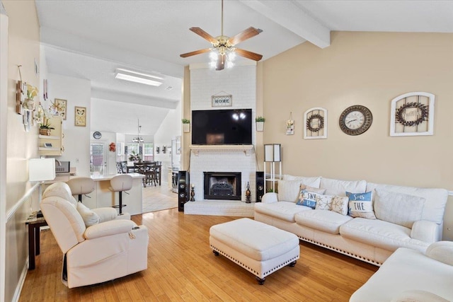 2518 Bassfield Dr, Memphis, TN 38133 - living area with a ceiling fan, wood finished floors, and a fireplace