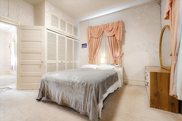 2102 Carr Ave, Memphis, TN 38104 - bedroom with light colored carpet and a closet